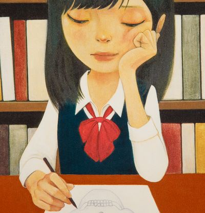 girl leans on her cheek whilst drawing a skull in a library