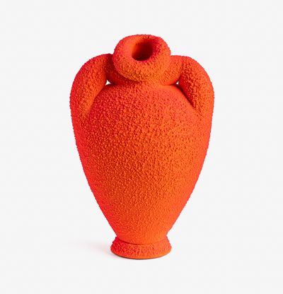 a neon orange curvaceous amphora with a speckled surface