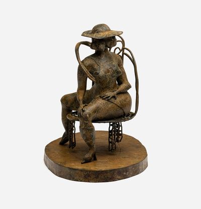 Bronze sculpture of seated woman with a hat