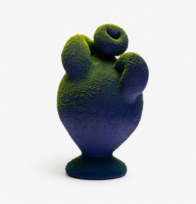 a rounded blue and green ombre amphora with two curved handles