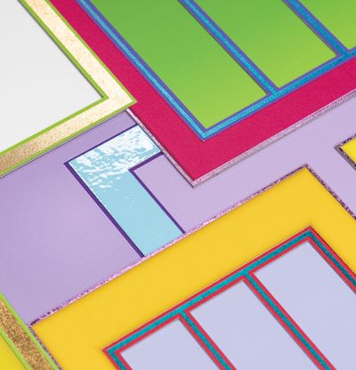 on-angle close up of a colourful, rectilinear print showing a glossy, pale blue section