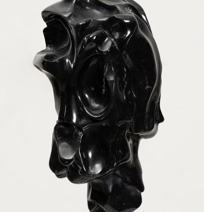 black marble sculpture on a bronze pole by Kevin Francis Gray - close up side
