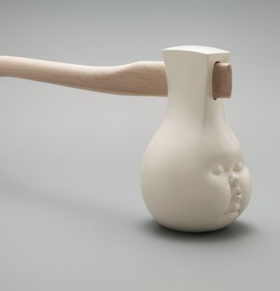 Human head with handle sticking out like axe, Fight for a Dream by Johnson Tsang