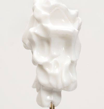 white marble sculpture on a bronze pole by Kevin Francis Gray - close up