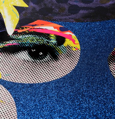 Detail of woman's face with blue glitter and coloured lines and details