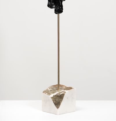 black marble sculpture on a bronze pole by Kevin Francis Gray - side view