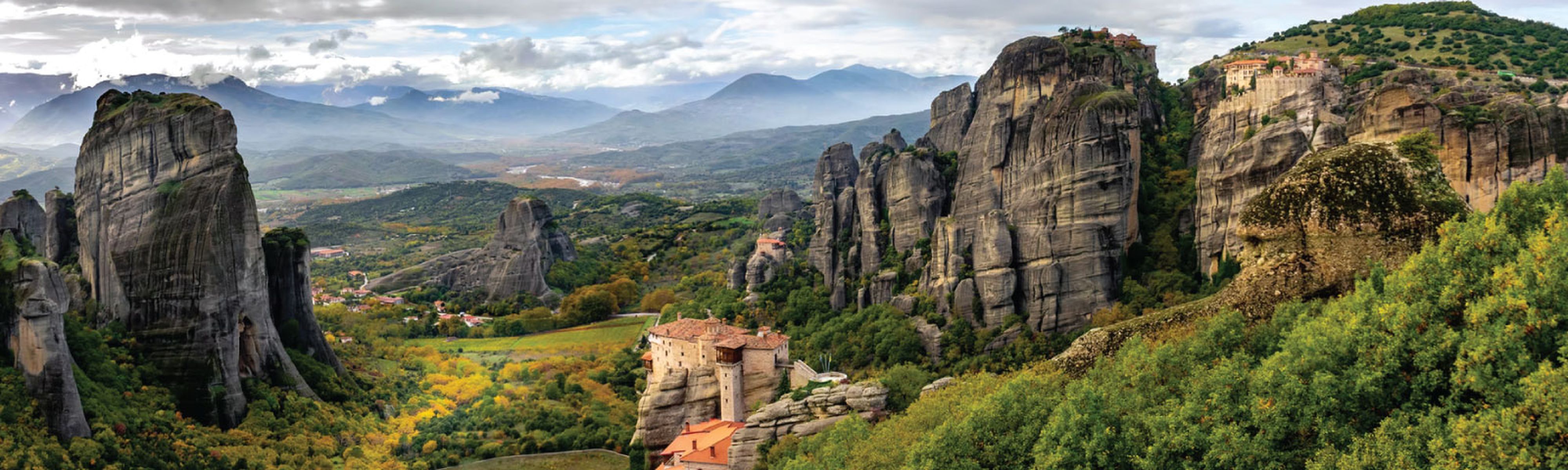 monastery sitting on rockly cliff in meteora greece