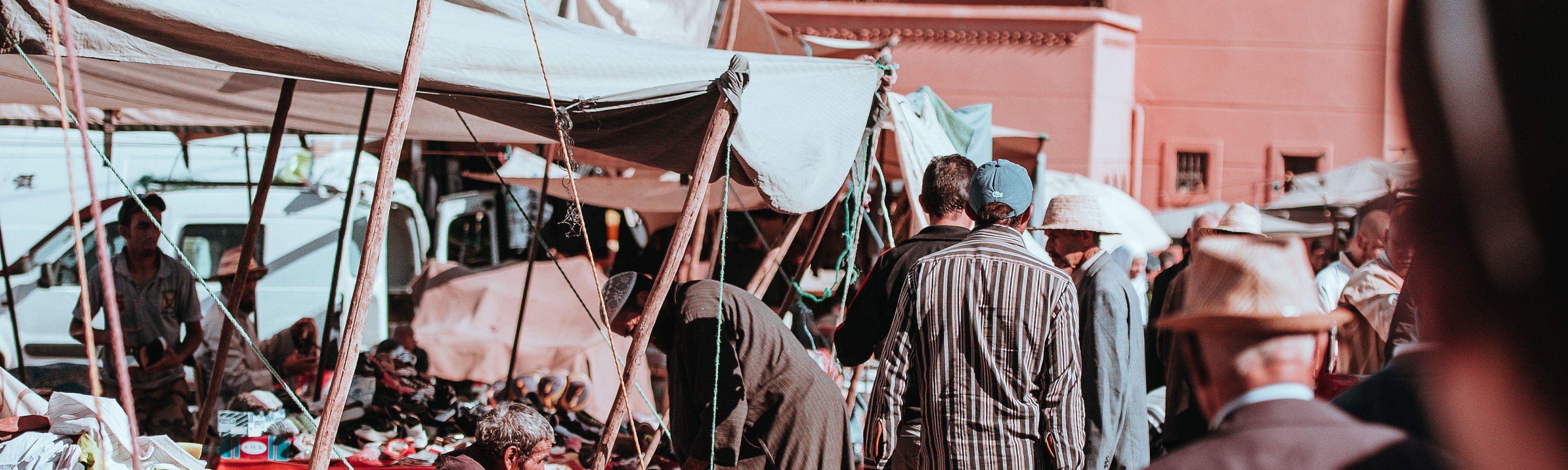 people walking through souks in marrakech