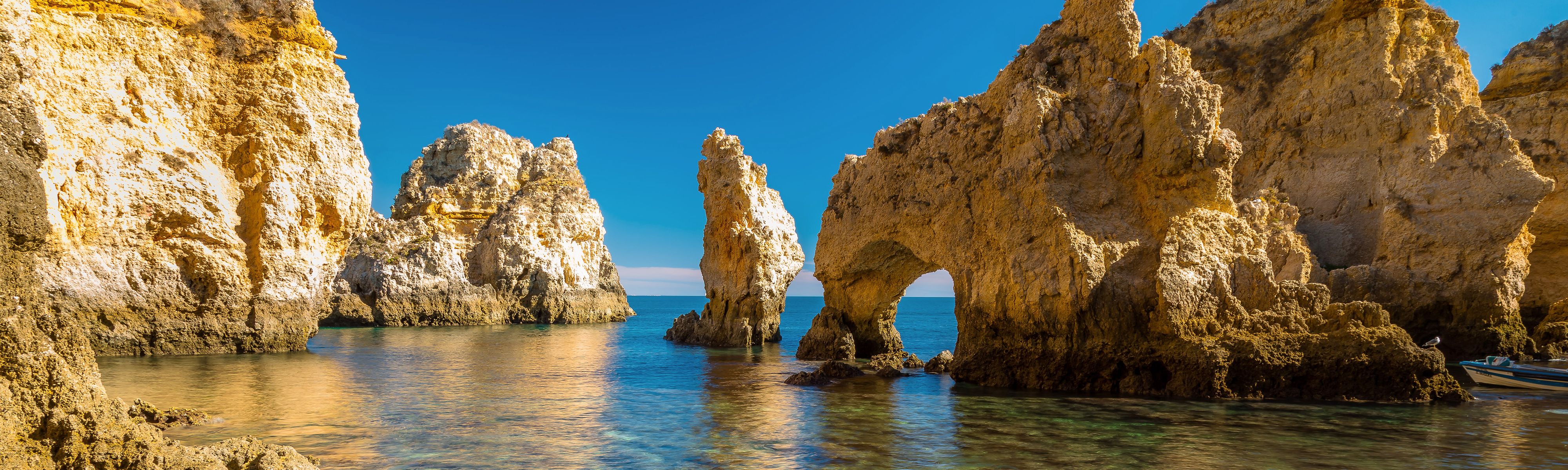 coastal caves along the ocean in lagos portugal