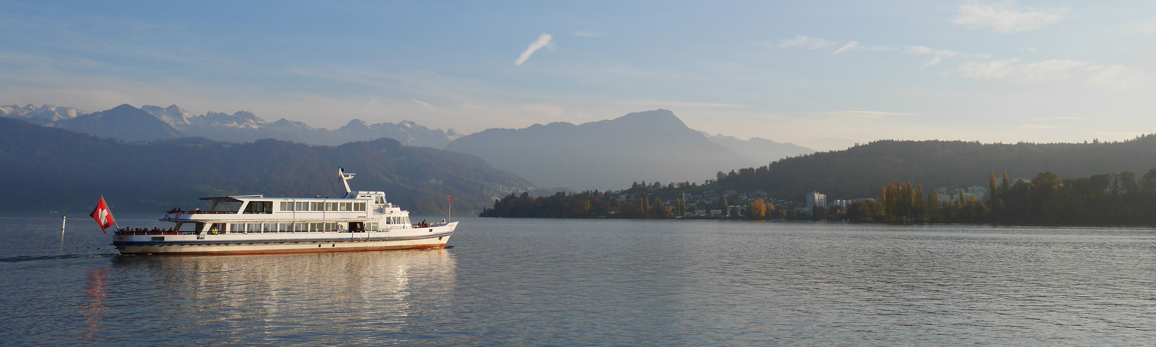 big white boat cruising on lake Lucerne in Switzerland