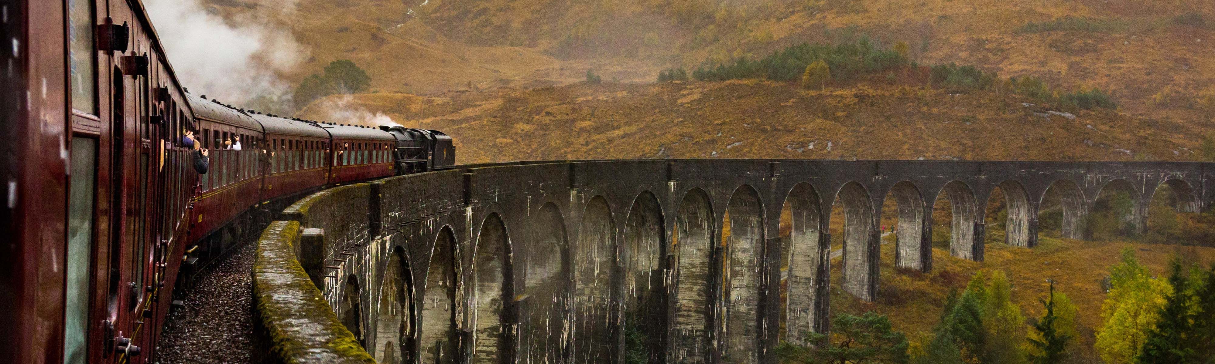 people riding a train in Scotland