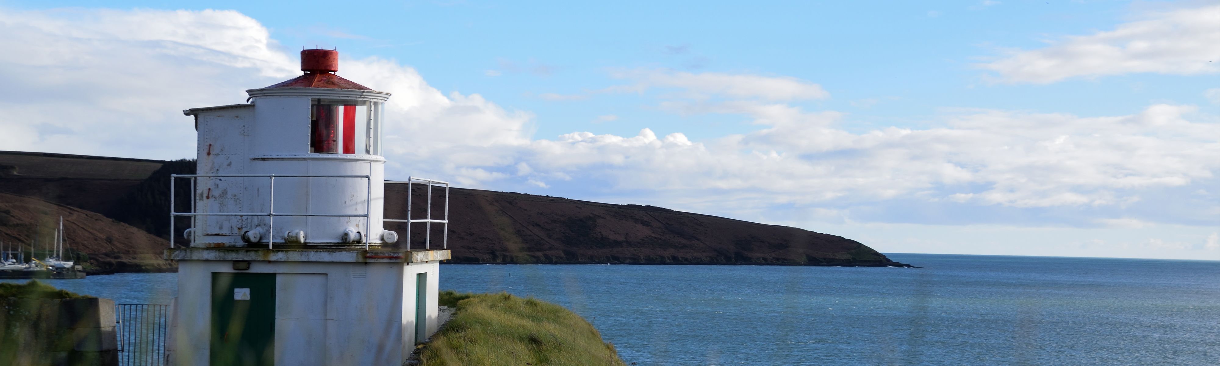 white lighthouse off the dingle peninsula in ireland