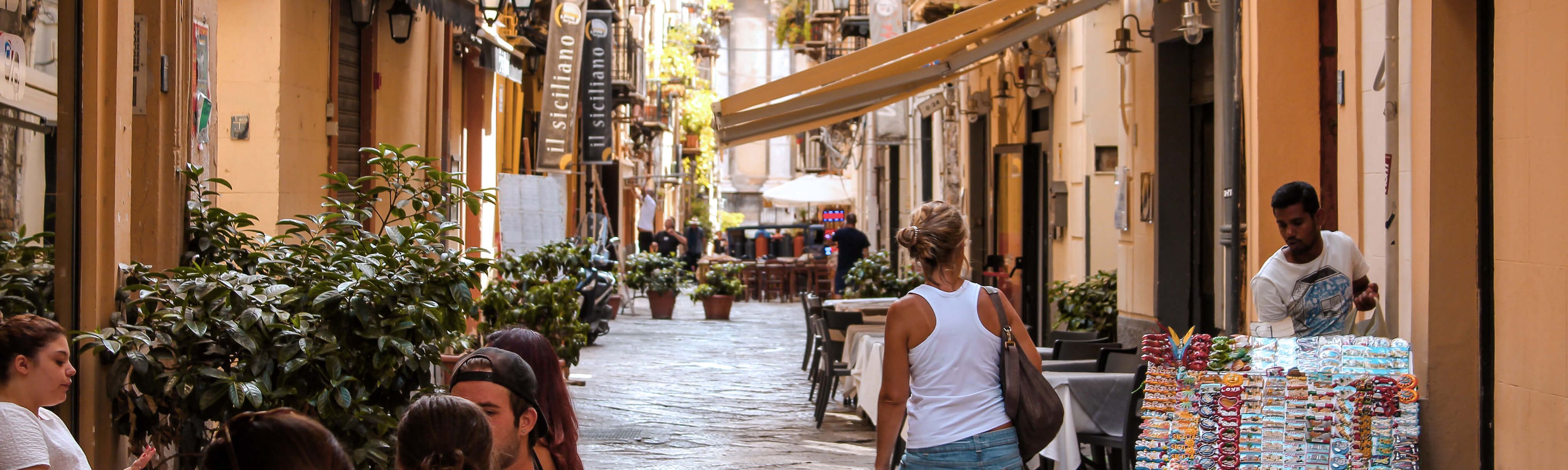 italian people walking down a street in italy