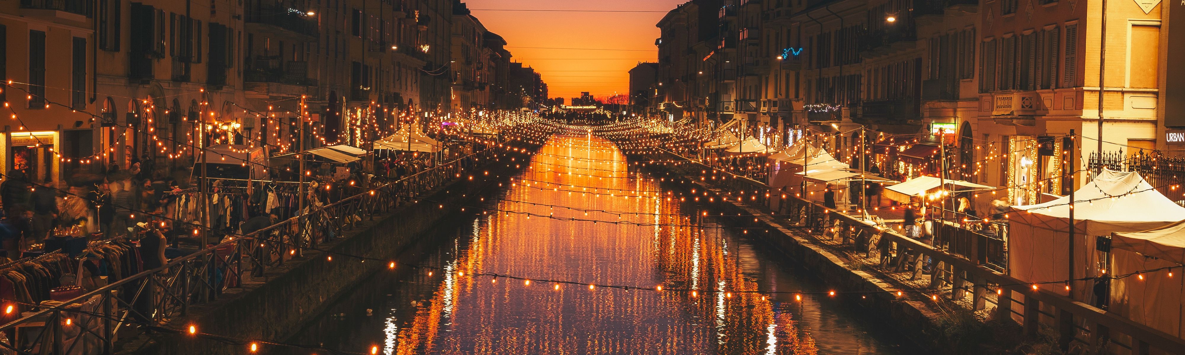 strung up lights crossing over canal in venice italy at night