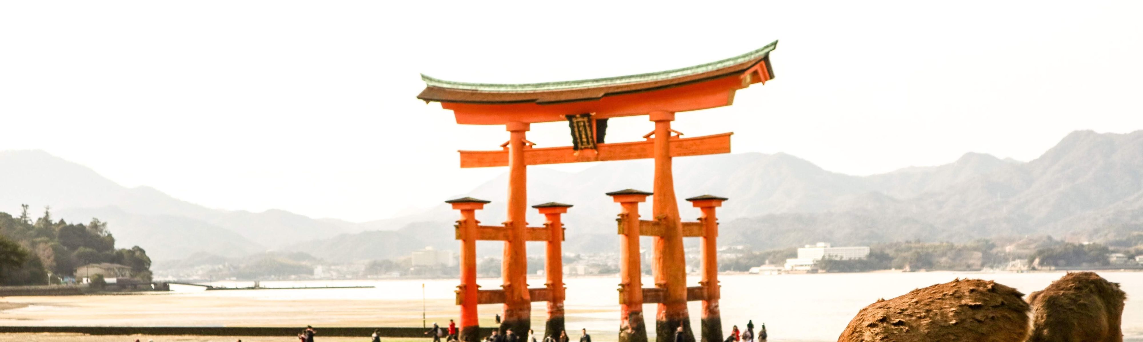 people standing in front of Itsukushima shrine in hakone
