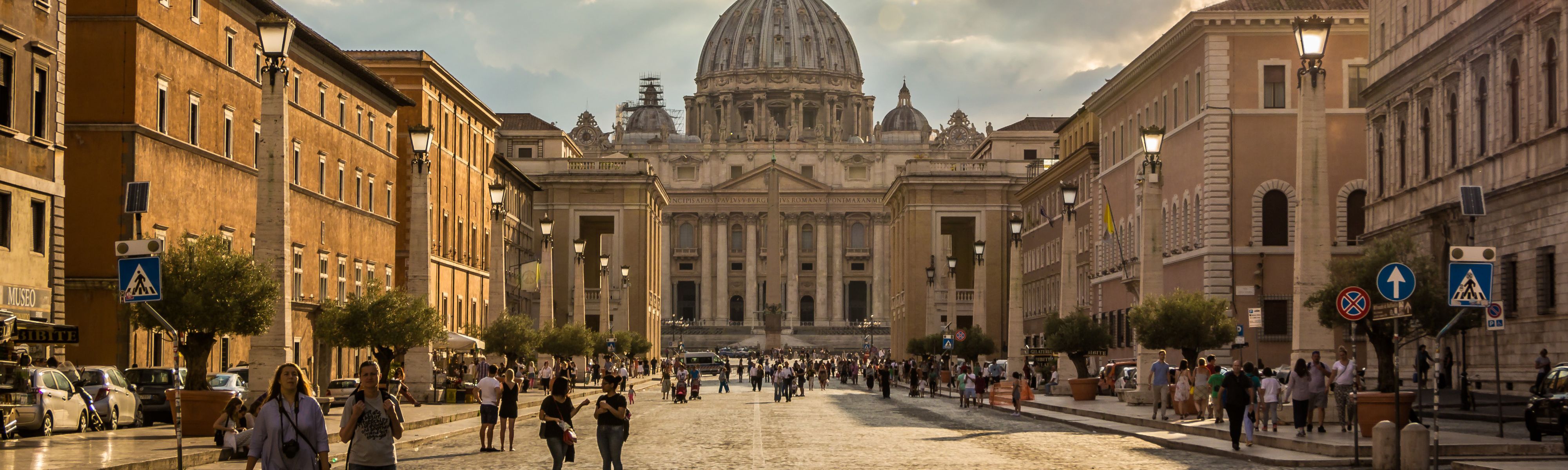 people walking in front of the vatican in rome italy