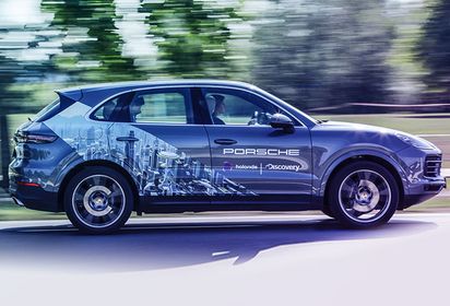 A Porsche Cayenne takes passengers into a “world of worlds”