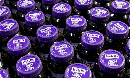 Aerial view of Welch's 100% Concord Grape Juice bottles.