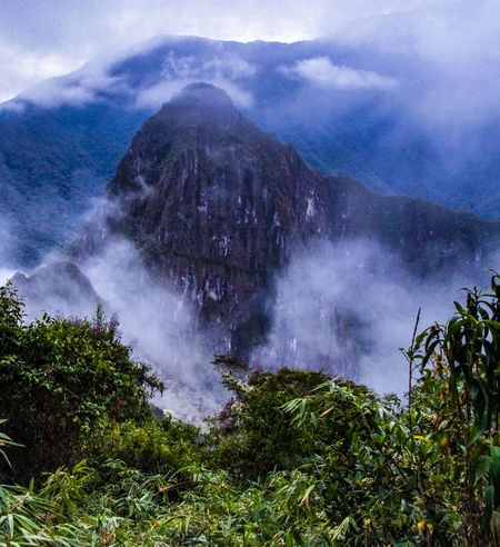 A mountain in Peru covered in fog.