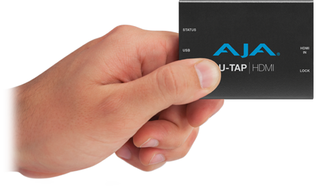A hand that's holding U-Tap device
