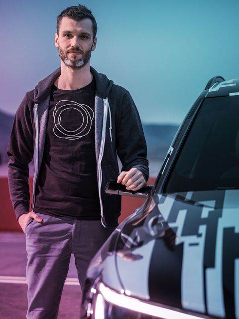 Daniel Profendiner, Co-founder & CTO of holoride, leaning on car