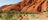 Woman-walking-towards Uluru