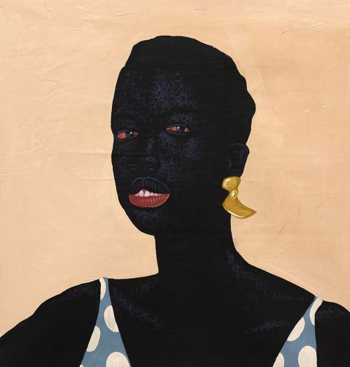 portrait of a black woman with gold earrings and a polka dot top on
