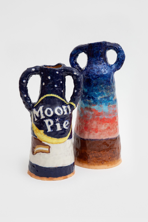 Two ceramic vases side by side, one reading 'Moon Pie'