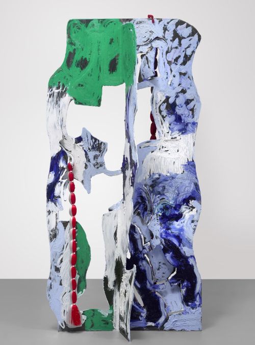 three-dimensional abstract sculpture with cut-out shapes and blue, white and green splashes of paint