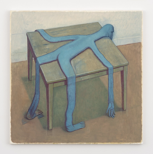 Blue long, thin figure lying over a table