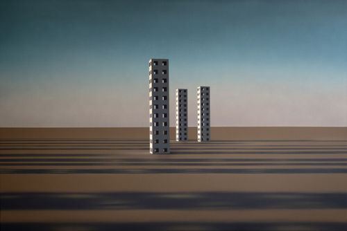 indistinct dessert landscape with three tower blocks set apart from one another