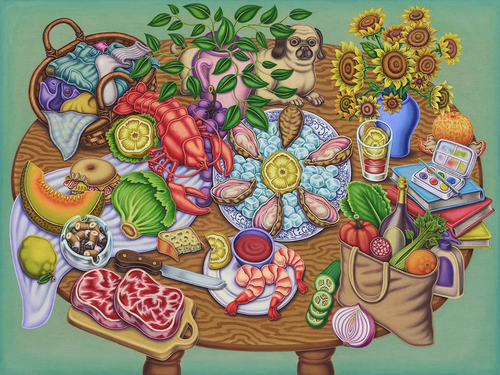 An array of food laid out on a wooden table with a mint green background