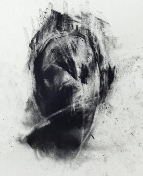 Charcoal drawing of a head on white paper