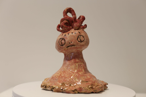 Small brown sculpture, facial features