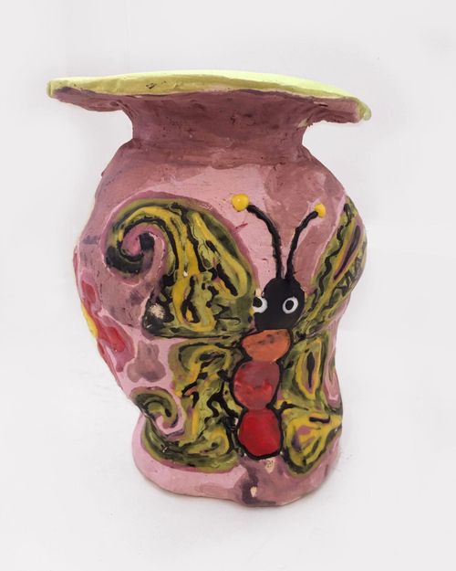 yellow butterfly painted on pink vase
