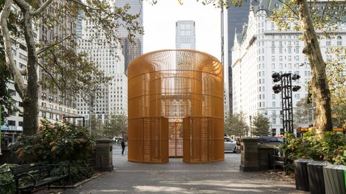 an outdoor sculpture installation created from large orange bars by Ai Weiwei