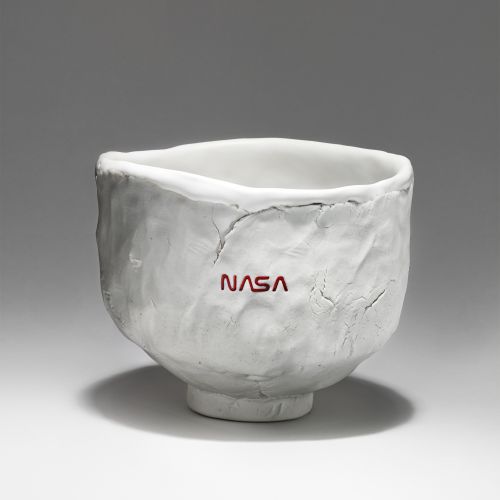 irregular clay bowl with small red NASA logo
