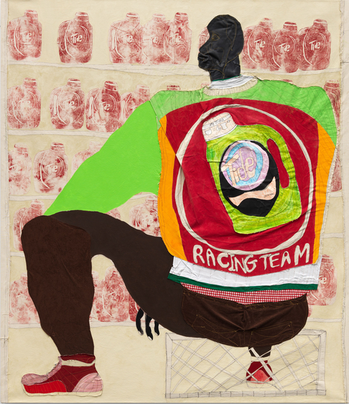 a man crouching down while wearing a colourful racing jacket