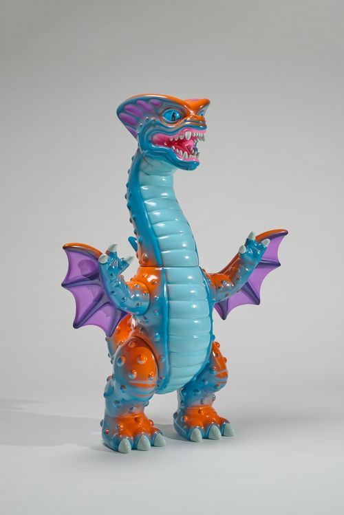 a sculpture of an orange, blue and purple dragon