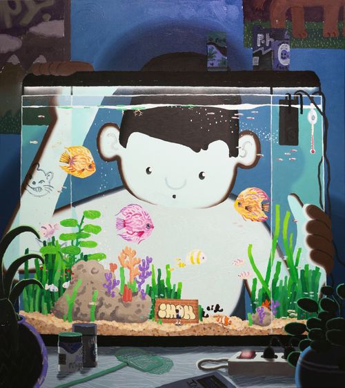 a man standing behind a fish tank peering into it