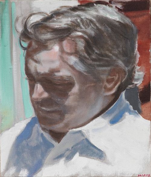 Portrait of a middle-aged man in a white shirt casting his gaze down and away from the viewer