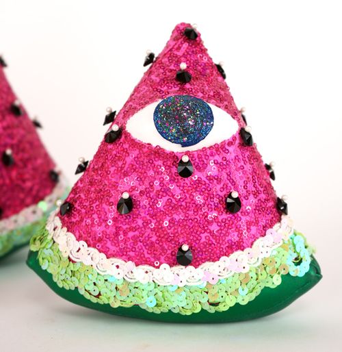 Sequin-covered triangle of watermelon with an eye on it