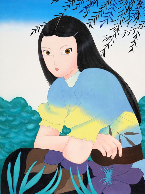 Female seated in nature, blue and yellow blouse