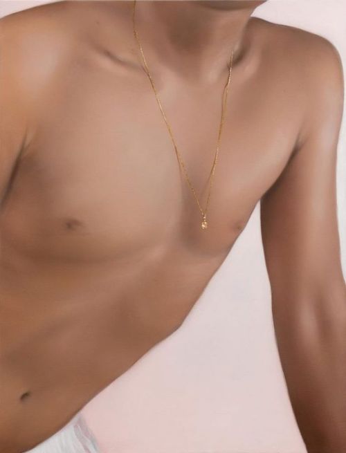 snapshot view of a nude male torso with softened flesh and a delicate gold chain necklace with charm hanging loosely from his neck