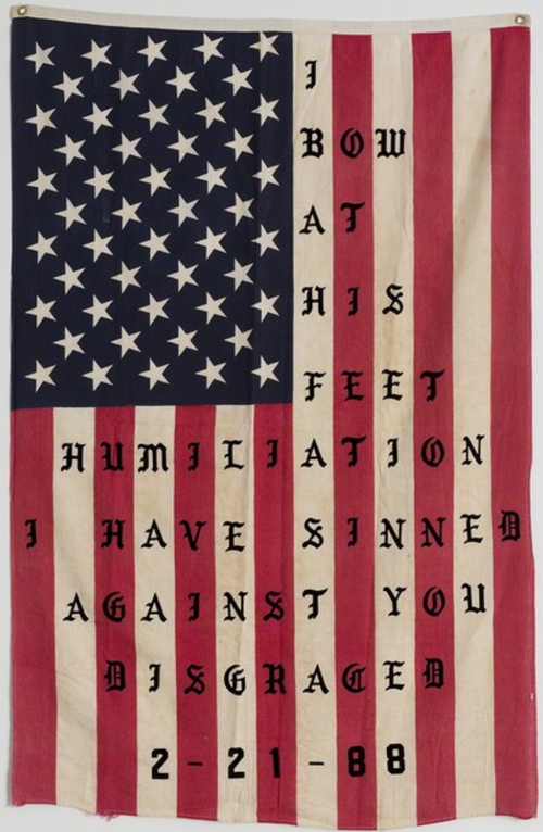 American flag with text printed on it in a gothic font
