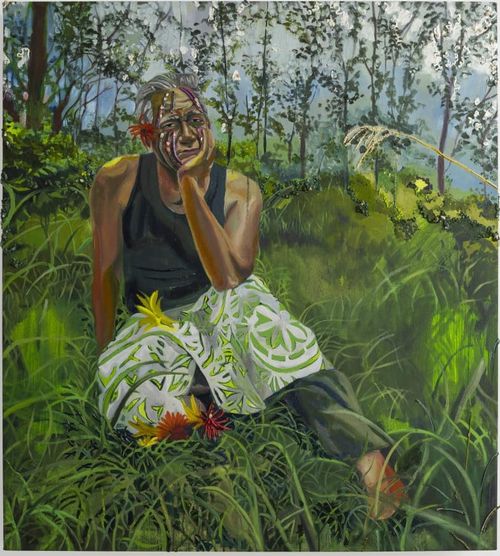 man sitting in the grass 