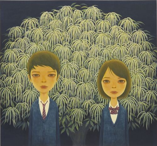 A boy and girl wearing matching uniforms stood before a tree