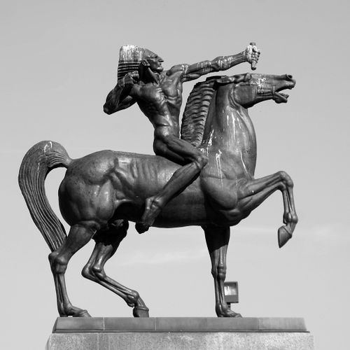 Ivan Mestrovic’s mounted Bowman and Spearman face each other from plinths on either side of Ida B. Wells Drive, just east of Michigan Avenue.  The two Indian horsemen are unclothed and are symmetrically and artificially pose – as if frozen – to launch strangely invisible weapons. The musculature of both horse and rider is meticulously delineated and emphasized and the proportions of each also somewhat artificial and stylized.