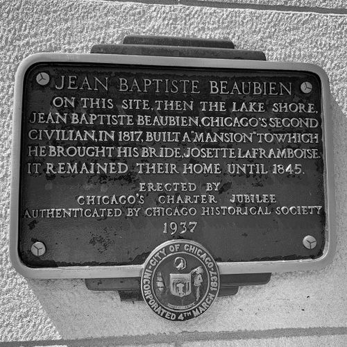The plaque is inscribed: "Jean Baptiste Beaubien - On this site, then the lake shore, Jean Baptiste Beaubien, Chicago's second civilian, in 1817, built a mansion to which he brought his bride, Josette LaFramboise. It remained their home until 1845. - Erected by Chicago's Charter Jubilee - Authenticated by Chicago Historical Society - 1937."