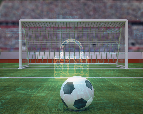 A soccer ball on a field in front of a goal with a transparent digital lock symbol overlayed, symbolizing security.